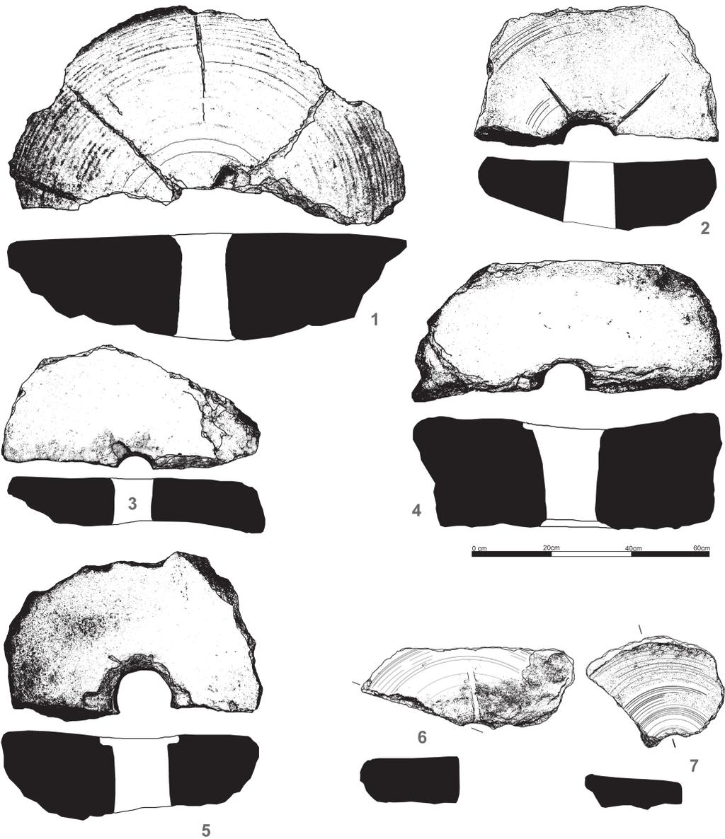 Doklady primární úpravy rud suchou cestou Obr. 104. Jihlava Staré Hory I a III. Fragmenty mlecích kamenů nalezené při archeologických výzkumech v letech 2002 2006.