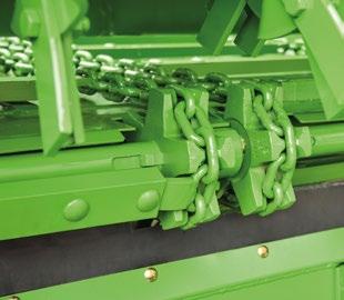 Podlahový dopravník s hydraulickým pohonem Čtyři článkové ocelové řetězy (každý 14 x 50 mm, 25 t/řetěz) leží hluboko ve velkých zubech řetězových kol (malé opotřebení).