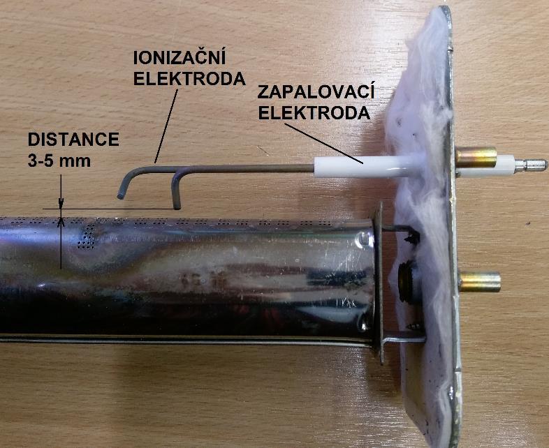 pohasnutí plamene hlavního hořáku. Tak docílíte bodu sepnutí minimálního výkonu topidla.