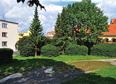 Vlevo bytové domy na ul. Otakara Chlupa.