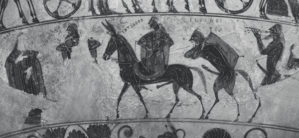 V pravé ruce drží keras (picí roh), levou rukou drží krk osla. Za oslem jde Dionýsos oděný do dlouhého chitónu a himatia.