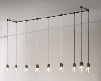 La finitura proposta è ottone anticato. Brass pendant with transparent glass diffuser, also available in versions with or without reflector. Pendant is supplied with a 3-meter-long cable.