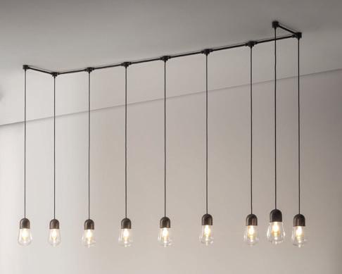 La finitura proposta è ottone anticato. Brass pendant with transparent glass diffuser, also available in versions with or without reflector. Pendant is supplied with a 3-meter-long cable.