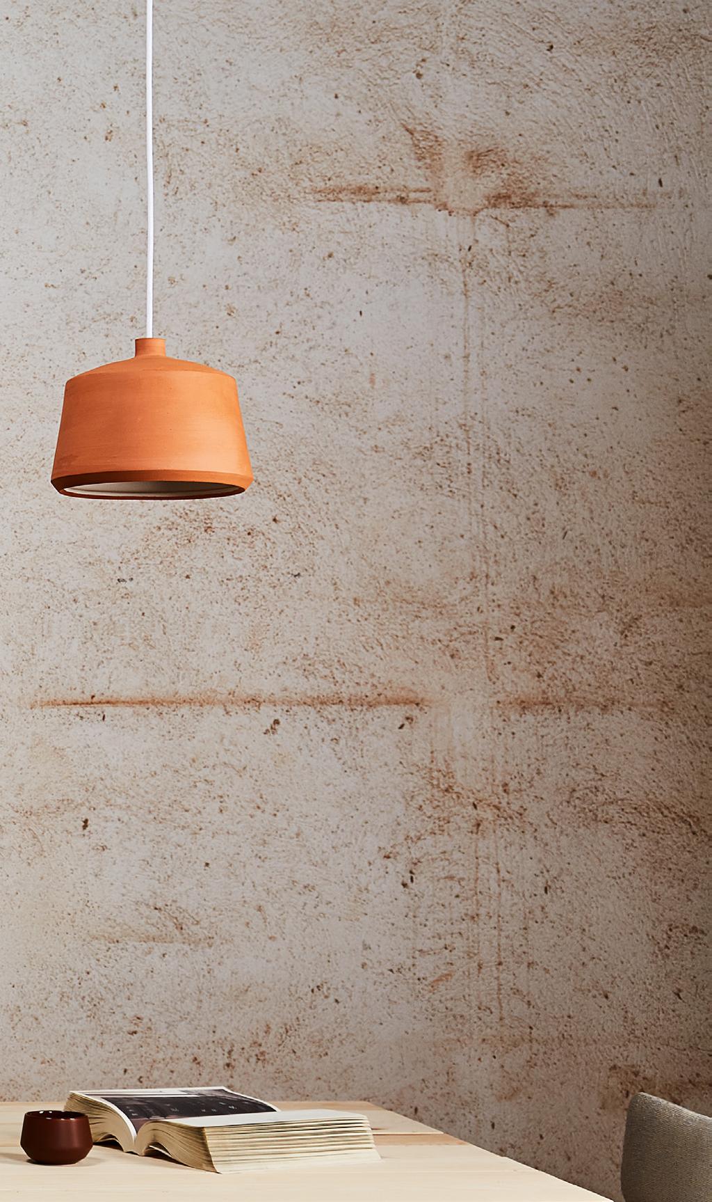 Crafted from natural terracotta, Pott s Flame pendant lamp collection wears two personalities: the exterior has been left au naturel and unvarnished while the interior softly contrasts by proposing a