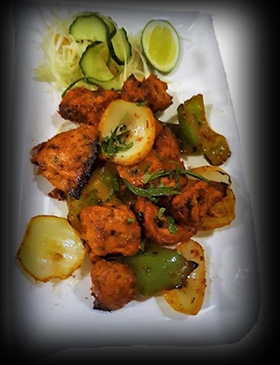 Tandoori Chicken Shashlik (220 g) (7) 170 Kč Kousky kuřete, kostičky papriky, rajčat a cibule, marinované v zázvorovo-česnekové pastě, indickém koření a