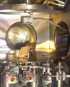 distribution. The plasma is generated above the table by 600 W, RF generator operated at 13.56 MHz. As a counter electrode at the RIE process the whole chamber is used. a) b) Fig.