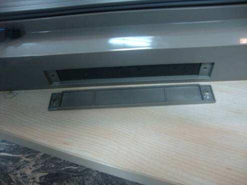 the door by means of a screw will