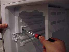 REMOVING THE FREEZER EVAPORATOR COVER First,